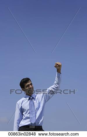 Indian businessman raising his fist. View Large Photo Image Stock Photo - Indian businessman raising his fist.. Fotosearch