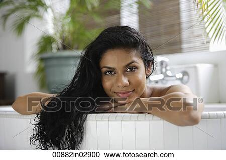Indian woman in bath and looking at camera View Large Photo Image Stock Image - Indian woman in bath and looking at camera. Fotosearch
