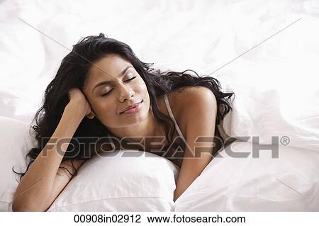 Indian woman relaxing in bed View Large Photo Image Stock Image - Indian woman relaxing in bed. Fotosearch