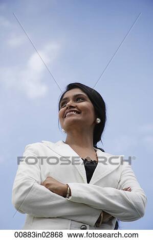 Portrait of Indian woman folding her arms and looking up. View Large Photo Image Stock Photo - Portrait of Indian woman folding her arms and looking up.. Fotosearch