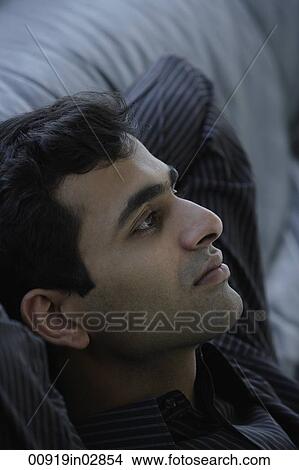 Profile of Indian man wearing black. View Large Photo Image Picture - Profile of Indian man wearing black.. Fotosearch