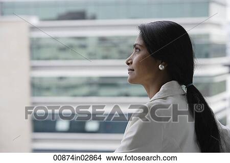 Profile of Indian woman looking at building. View Large Photo Image Picture - Profile of Indian woman looking at building.. Fotosearch