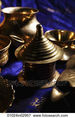 Close up of bronze Indian containers and bowls View Large Photo Image Stock Photo - Close up of bronze Indian containers and bowls. Fotosearch