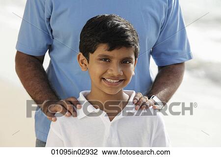 Cropped shot of father's hands on smiling son's shoulders View Large Photo Image Stock Image - Cropped shot of father's hands on smiling son's shoulders. Fotosearch