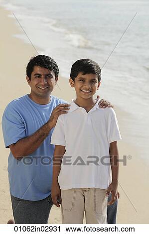 Father holding son's shoulders and smiling View Large Photo Image Stock Image - Father holding son's shoulders and smiling. Fotosearch