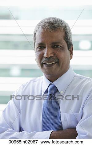 Stock Photo - Head shot of Indian business man. Fotosearch