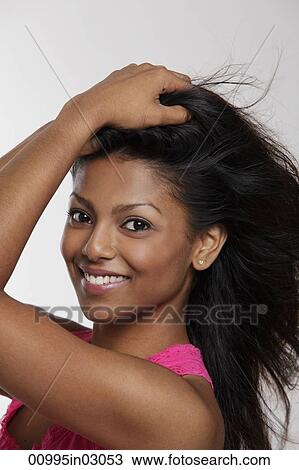 head shot of smiling woman holding her hair View Large Photo Image Stock Image - head shot of smiling woman holding her hair. Fotosearch