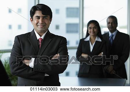 Indian business man standing in front of colleagues View Large Photo Image Stock Image - Indian business man standing in front of colleagues. Fotosearch