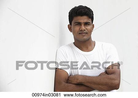 Man leaning against white wall View Large Photo Image Stock Image - Man leaning against white wall. Fotosearch