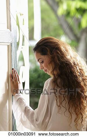 Profile of woman with long hair in doorway View Large Photo Image Stock Image - Profile of woman with long hair in doorway. Fotosearch