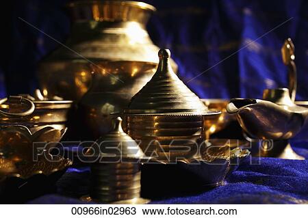 Still life of brass bowls and cups on table View Large Photo Image Stock Image - Still life of brass bowls and cups on table. Fotosearch