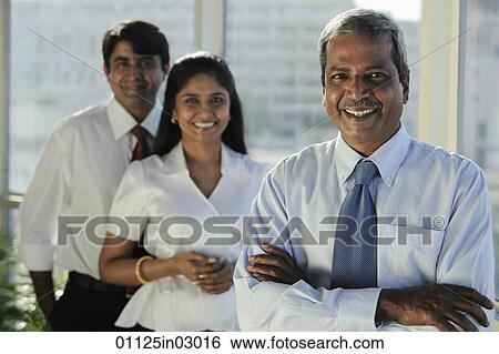 Three Indian business people smiling together View Large Photo Image Stock Photograph - Three Indian business people smiling together. Fotosearch
