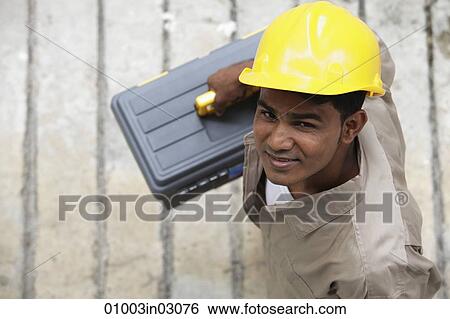 Top view of man wearing construction hat View Large Photo Image Stock Photograph - Top view of man wearing construction hat. Fotosearch