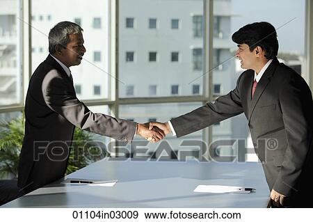 Two Indian business men shaking hands View Large Photo Image Stock Photo - Two Indian business men shaking hands. Fotosearch