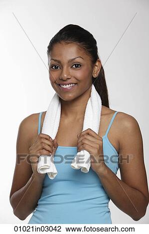 woman holding small towel around neck and smiling View Large Photo Image Stock Image - woman holding small towel around neck and smiling. Fotosearch