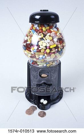 Stock Image - Assorted tablets and capsules in a gumball machine. Fotosearch
