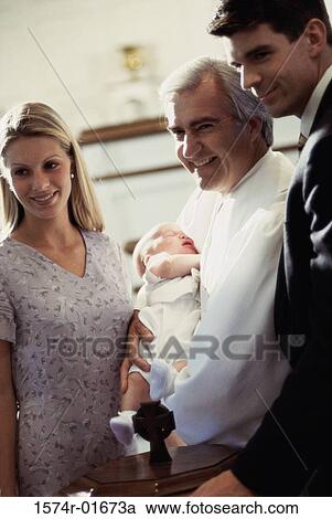 Baptism of a baby boy in a Catholic church View Large Photo Image Stock Image - Baptism of a baby boy in a Catholic church. Fotosearch
