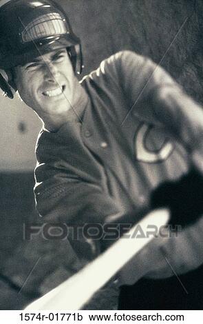 Stock Image - Baseball player swinging a bat. Fotosearch