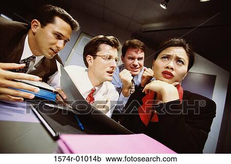 Stock Image - Business executives in a meeting. Fotosearch