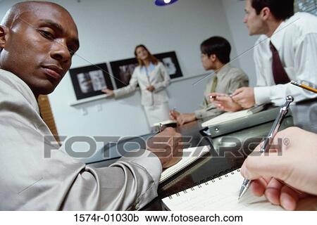 Business executives in a meeting View Large Photo Image Stock Image - Business executives in a meeting. Fotosearch