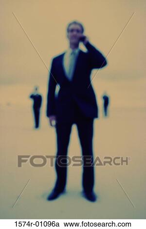 Stock Image - Businessman talking on a mobile phone. Fotosearch