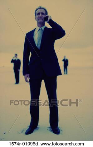 Businessman talking on a mobile phone View Large Photo Image Stock Image - Businessman talking on a mobile phone. Fotosearch