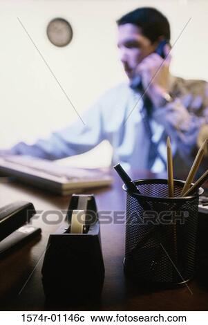 Businessman talking on a telephone View Large Photo Image Stock Image - Businessman talking on a telephone. Fotosearch