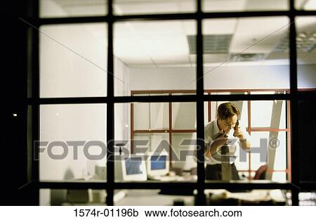 Stock Image - Businessman talking on a telephone. Fotosearch