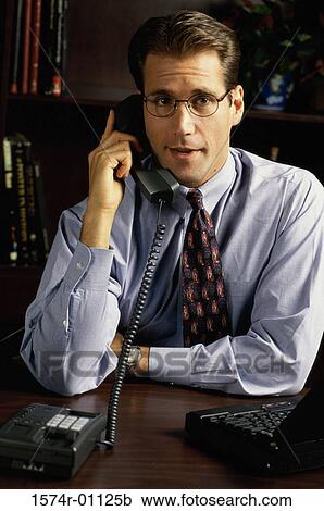 Businessman talking on the telephone View Large Photo Image Stock Image - Businessman talking on the telephone. Fotosearch