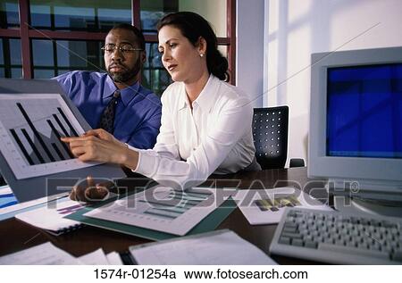 Businesswoman pointing to a graph View Large Photo Image Stock Image - Businesswoman pointing to a graph. Fotosearch