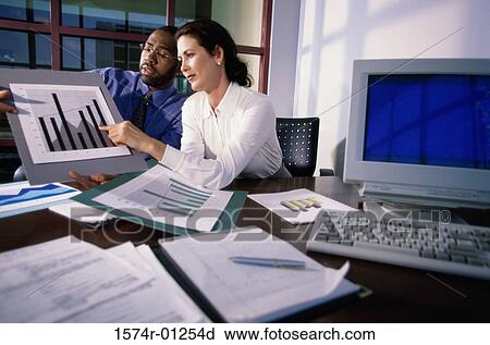 Businesswoman pointing to a graph View Large Photo Image Stock Image - Businesswoman pointing to a graph. Fotosearch