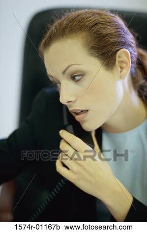 Stock Image - Businesswoman talking on a telephone. Fotosearch