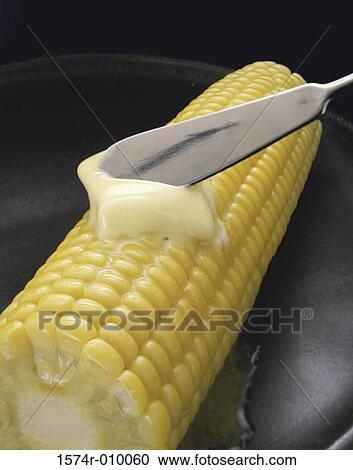Butter applied to corn on the cob View Large Photo Image Stock Image - Butter applied to corn on the cob. Fotosearch