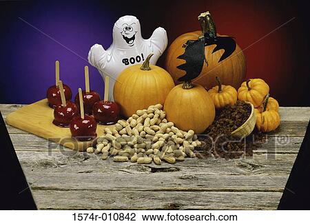 Candy apples next to pumpkins and nuts View Large Photo Image Stock Image - Candy apples next to pumpkins and nuts. Fotosearch