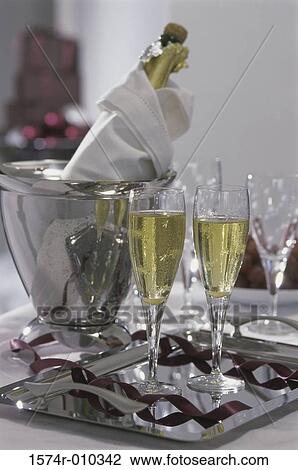Champagne in a bucket with glasses View Large Photo Image Stock Image - Champagne in a bucket with glasses. Fotosearch