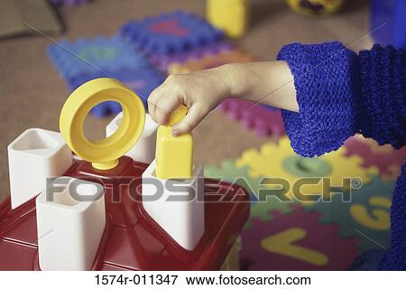 Child playing with toys View Large Photo Image Stock Photo - Child playing with toys. Fotosearch