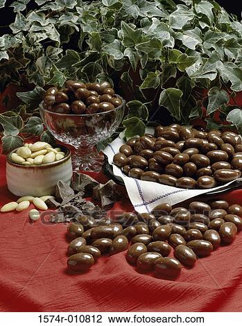 Chocolate coated nuts served in a platter and bowl View Large Photo Image Stock Image - Chocolate coated nuts served in a platter and bowl. Fotosearch
