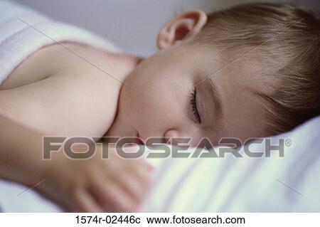 Stock Image - Close-up of a baby boy sleeping. Fotosearch