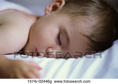 Stock Image - Close-up of a baby boy sleeping. Fotosearch