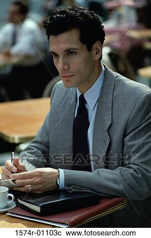 Close-up of a businessman sitting and thinking View Large Photo Image Stock Image - Close-up of a businessman sitting and thinking. Fotosearch