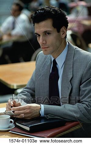 Stock Image - Close-up of a businessman sitting. Fotosearch