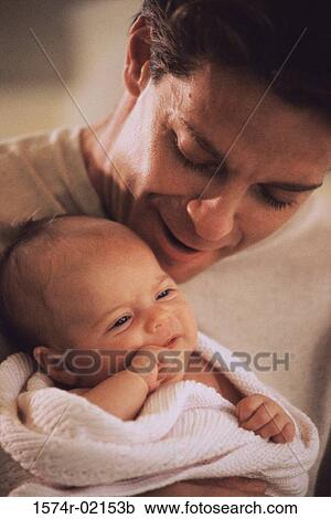 Close-up of a father carrying his baby boy View Large Photo Image Stock Image - Close-up of a father carrying his baby boy. Fotosearch