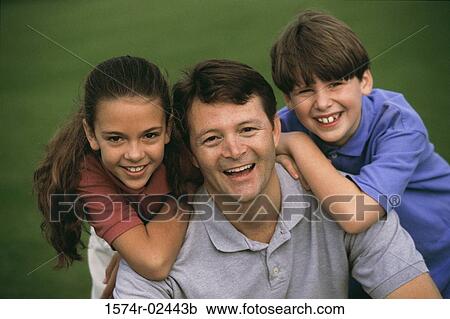 Close-up of a father with his son and daughter View Large Photo Image Stock Image - Close-up of a father with his son and daughter. Fotosearch