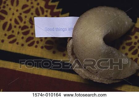 Close-up of a fortune cookie with a message View Large Photo Image Picture - Close-up of a fortune cookie with a message. Fotosearch