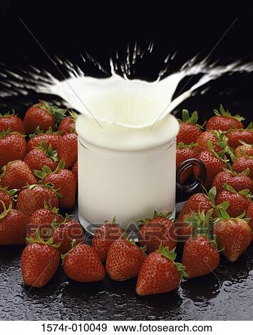 Close-up of a jar of milk and strawberries View Large Photo Image Stock Photo - Close-up of a jar of milk and strawberries. Fotosearch