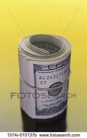 Close-up of a roll of American dollar bills View Large Photo Image Stock Image - Close-up of a roll of American dollar bills. Fotosearch