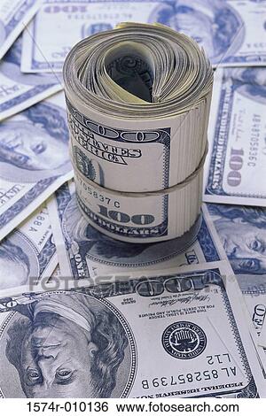 Close-up of a roll of American dollar bills View Large Photo Image Stock Photograph - Close-up of a roll of American dollar bills. Fotosearch