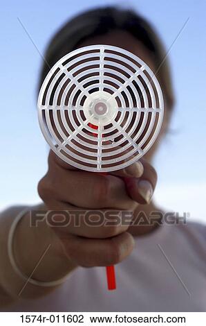 Close-up of a young woman holding a toy gun View Large Photo Image Stock Image - Close-up of a young woman holding a toy gun. Fotosearch