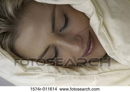 Close-up of a young woman sleeping View Large Photo Image Picture - Close-up of a young woman sleeping. Fotosearch