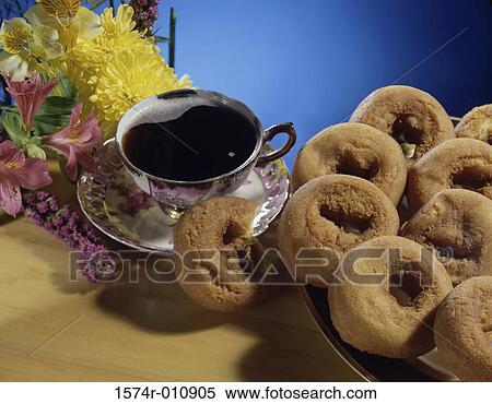 Close-up of doughnuts with coffee View Large Photo Image Stock Photography - Close-up of doughnuts with coffee. Fotosearch